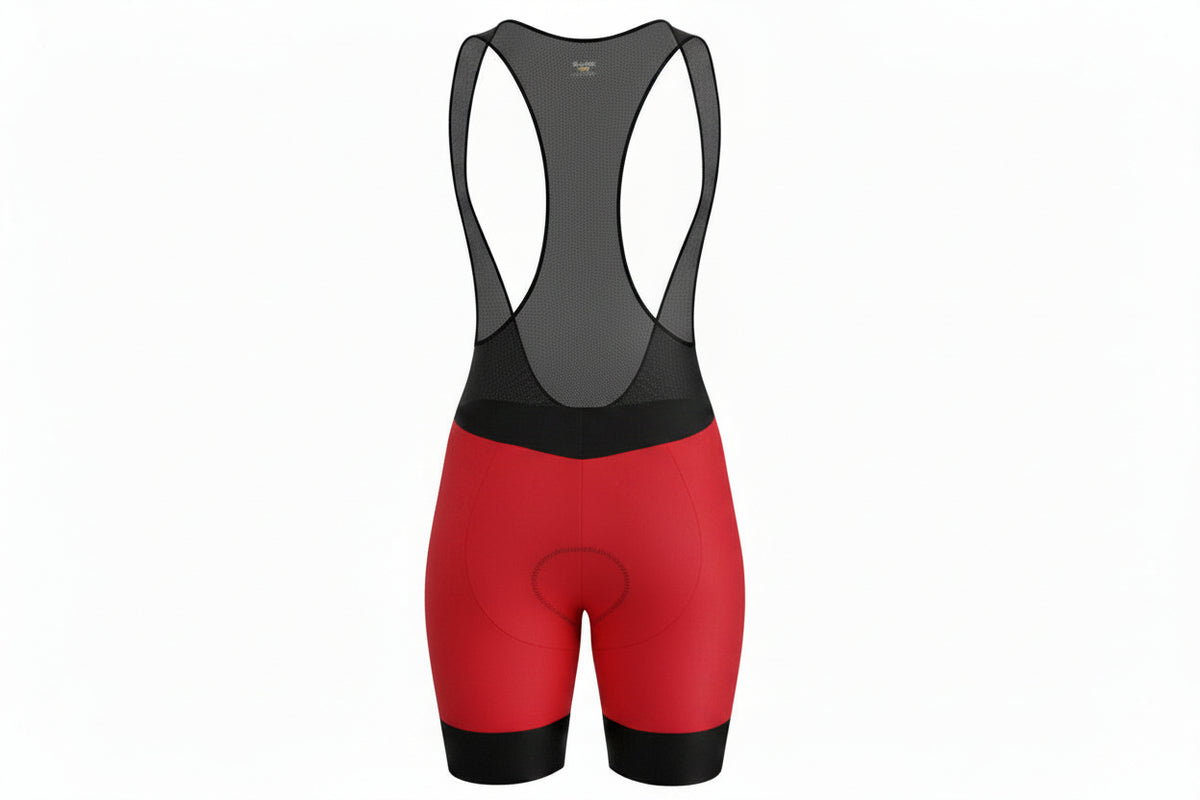 Licra corta de ciclismo roja para mujer de la línea Pro vista frontal con tirantes de malla de A Guapa Bike.