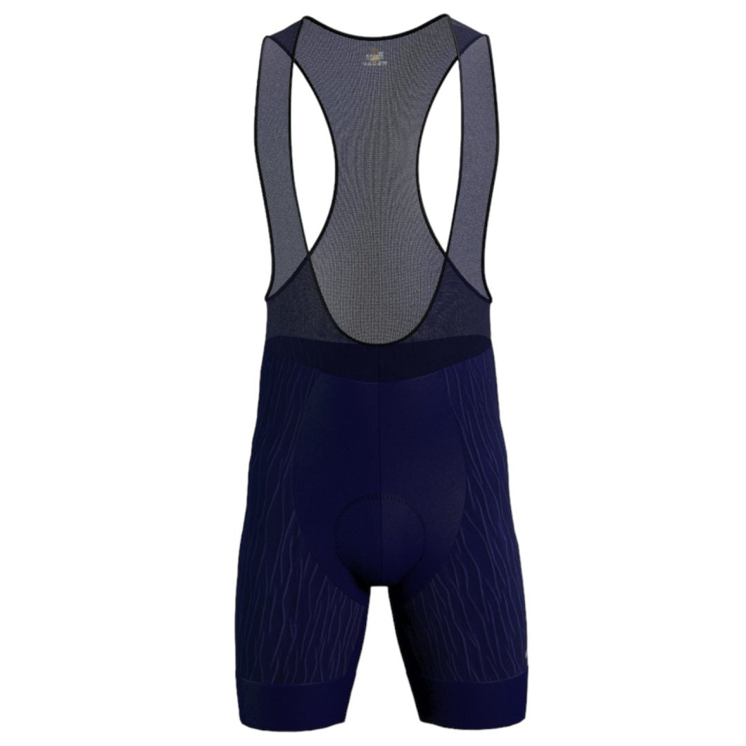 Licra corta de ciclismo azul oscuro en tela grabada para hombre de la línea Pro vista frontal con tirantes en malla de A Guapa Bike.
