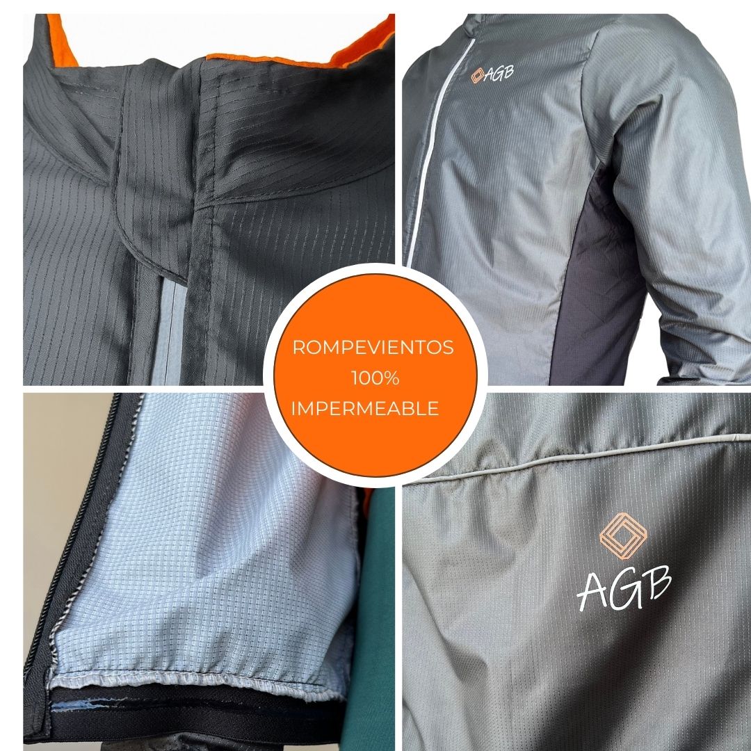 Cubre cremallera superior para comodidad en el cuello Primer plano de los paneles laterales en malla transpirable de la chaqueta impermeable de ciclismo Textura de tela 100% impermeable con bolsillo interno de seguridad para ciclistas Ajuste perfecto de la chaqueta gracias a la banda de silicona antideslizante en el dobladillo inferior.