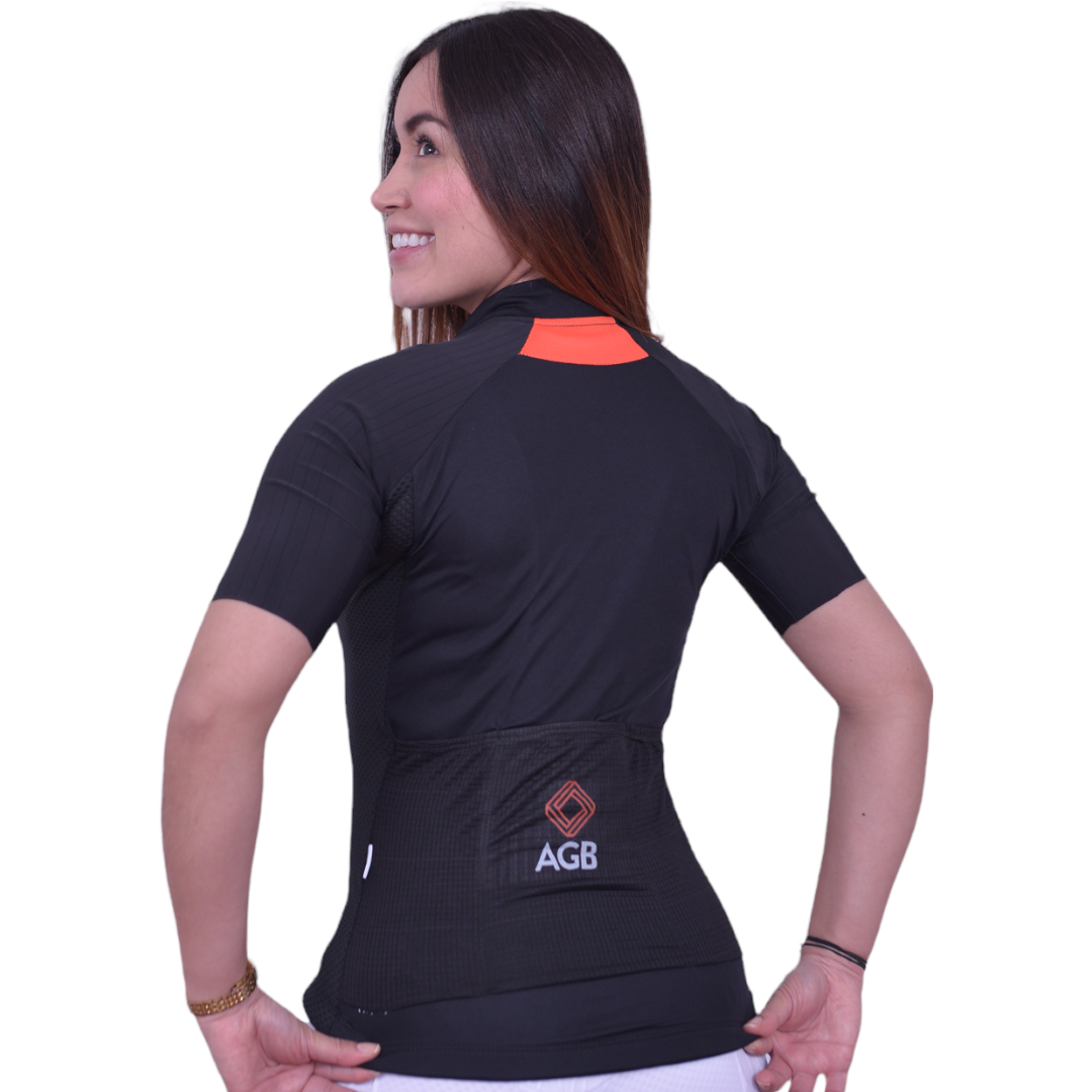 Jersey de ciclismo Pro negro para dama vista trasera con punto reflectivo de A Guapa Bike.