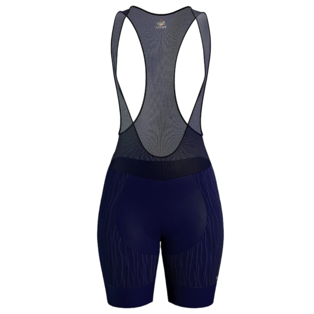 Licra corta de ciclismo azul oscuro para mujer de la línea Pro vista frontal con tirantes de malla de A Guapa Bike.