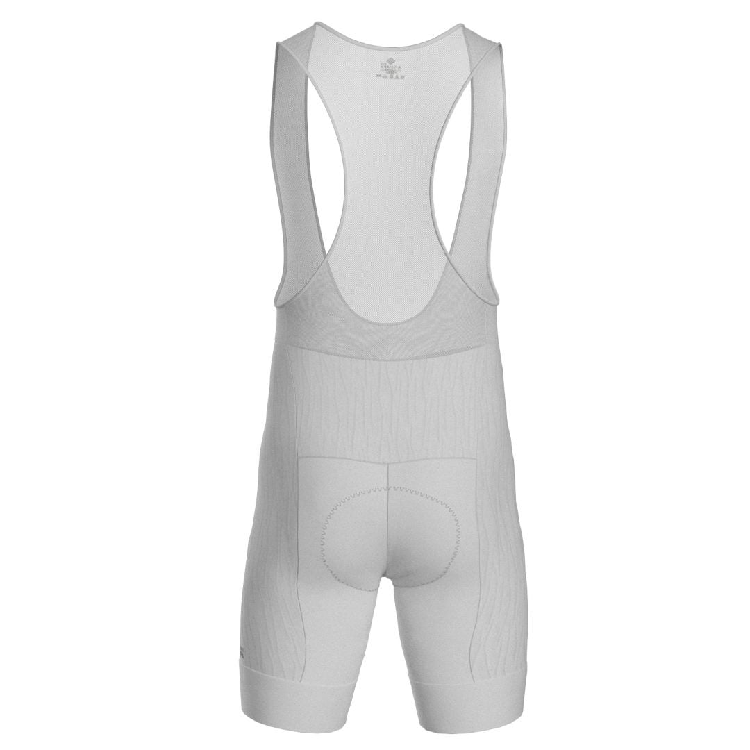 Licra corta de ciclismo blanca para hombre de la línea Pro vista trasera con tirantes en red ultra transpirables de A Guapa Bike.